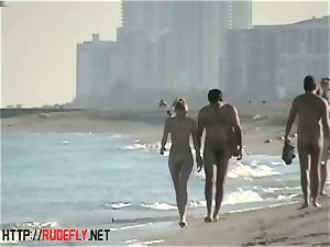 voyeurism at a sizzling nudist duo on the beach